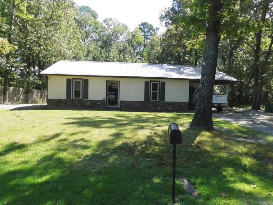 **Wonderful 3BR/2BA home just a couple of minutes to I-530**Only 10 minutes to downtown Little Rock**Maintenance-free vinyl siding/rock exterior with metal roof and gutters**20 x 20 shop with electricity and metal roof**Fenced back yard with adjoining property all timberland**Covered back patio to enjoy the wildlife that frequents the timberland**Interior features a living area with WBFP**Kitchen with updated appliances**Split bedroom plan and two full baths**Looking for a clean, neat as a pin home, come take a look**