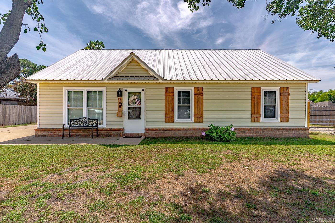 Welcome to Market 100 Gamble Lane of Manila, Arkansas within the Manila School District. Situated on a .38 +/- level lot sprinkled w/ shade trees is a 2002 built Renovated Ranchette wrapped in vinyl w/ a brick skirt, topped w/ a 2025 ribbed metal roof, and accented by 2025 windows, shutters, storm door, attached covered patio, and Hydrangea. The interior features 1,189 sf of well laid out living space and contains a large living room w/ tray ceiling, eat-in kitchen w/ bar seating, Master w/ tray ceiling and ensuite w/ walk-in mosaic & porcelain tiled shower, 2 spare bedrooms, spare bathroom w/ shower/tub combo, and laundry room w/ tankless water heater. The exterior holds a wired, plumbed, and heated 522 sf shop w/ 2 lean-tos, storage shed, 3 ck coops, 2 driveways w/ ample parking, and storm shelter. You'll love the renovations: roof, privacy fence, windows, 2nd driveway, remodeled bathrooms, waterproof LVP flooring throughout, fresh paint on walls & ceilings, fixtures & hardware, shiplap accents, and more. Conveniently located near favorite local amenities w/ easy access to Highway 18 and just 35 miles to Jonesboro and 70 miles to Memphis. Call today to make this house your home.