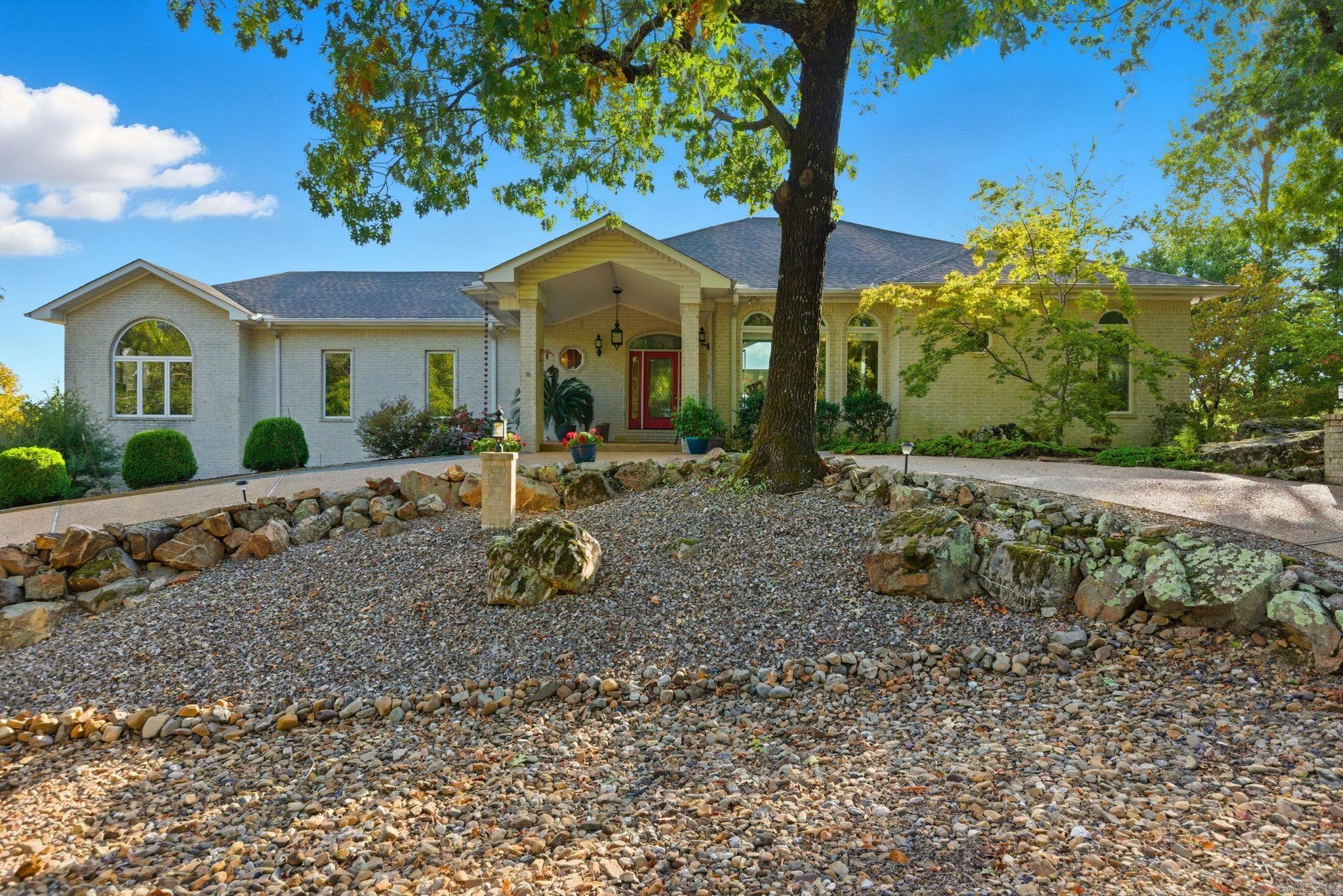 Why just read about it when you can see it in person? Come see this gorgeous view home that overlooks the Ouachita mountains and Lake DeSoto! Sit on your new covered composite wood deck and watch the world go by. This home features a wall of windows to enjoy the beauty of the great outdoors, a large circular driveway to welcome your guests, two master suites and study on the main level, and two bedrooms a bonus room and workshop and lots of storage on lower level. Upgrades include composite deck-2022, roof-2018, Main AC-2024, Lower AC-2023, Luxury Vinyl Tile-2018, sink, faucet, disposal and dishwasher-2023, gutter guards-2024, and two humidifiers-2023. Average electric bill is $250/Month. Make this immaculate, move-in-ready home YOURS and enjoy the good life...