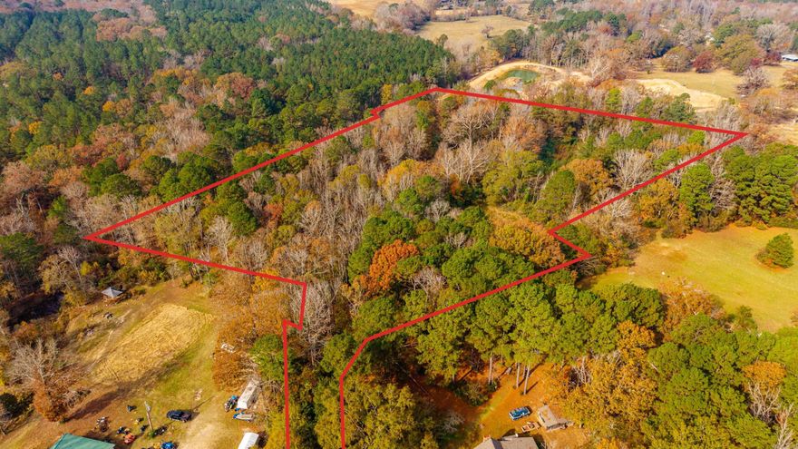 Escape to your own private oasis on the 8.97 wooded property located of Ridge Road. A beautiful mix of trees offers privacy and natural scenery, while utilities are at the road. Enjoy peaceful country living with benefits of being just minutes from town. Agents see remarks.