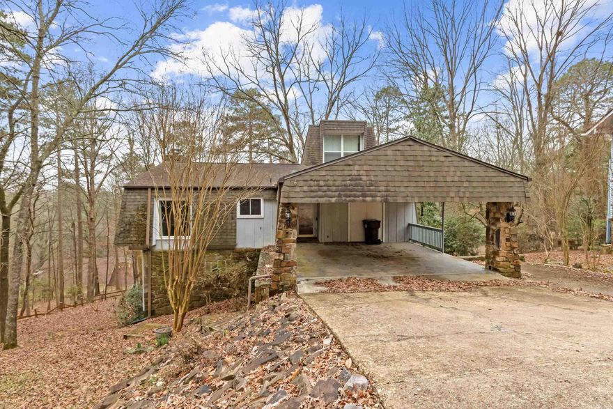 New roof in 2024. New water heater in 2023. 2600 sf home on TWO lots, sitting on the back side of the cul-de-sac, surrounded by trees in the back, a nice natural oasis.  Main level features a large kitchen/living area with rock fireplace.  The MBR features an upstairs loft area, access to outside deck, walk-in closet and large bathroom.  Downstairs has another large den with fireplace and access to deck outside, two large bedrooms, large bathroom and bonus area.  Lots of storage throughout the home. 2nd drive to rear of the house with ability to park additional vehicles.