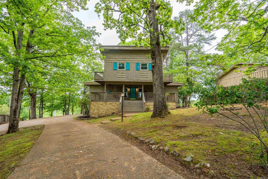 Whether you are looking for an investment or your forever home, the opportunities are endless. Currently this home is a successful short-term rental. Wake up to stunning water views in this spacious 5-bedroom, 4-bathroom home. With soaring vaulted ceilings and expansive windows, the interior is bright, open, and built for both comfort and entertaining. This beautiful home is adorned with updates including bathroom vanities, tile floors throughout, light fixtures, front porch swings, and more. Unwind in the brand-new hot tub while soaking in panoramic views of the lake and mountains. Enjoy your favorite beverage as you gaze out over the gorgeous landscape. Whether you're hosting or relaxing, the outdoor setting is unbeatable. Enjoy top-tier amenities including access to a golf course, lake, community pool, and playground—everything you need for resort-style living. This home offers the perfect blend of peace, space, and recreation.