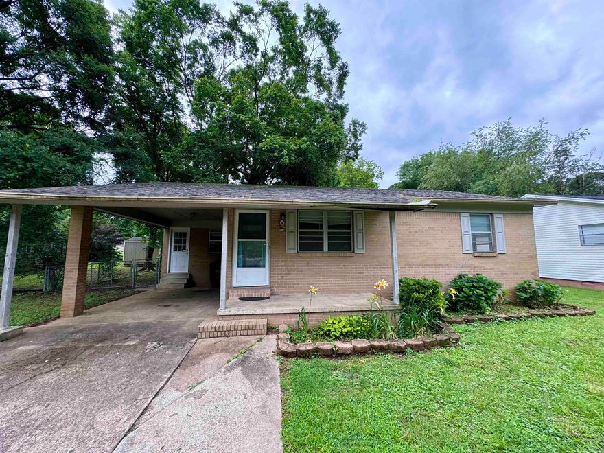 Check out this cozy three bedroom, two bath just minutes from downtown and the university.  Updated in 2015 that included new floors, water heater, appliances, counter tops, HVAC, and bathroom with a new roof and storage building added in 2016.  A little TLC will bring by the shine for an ideal rental or first time home.  Come see the potential for yourself! Fenced in back yard with storm shelter.