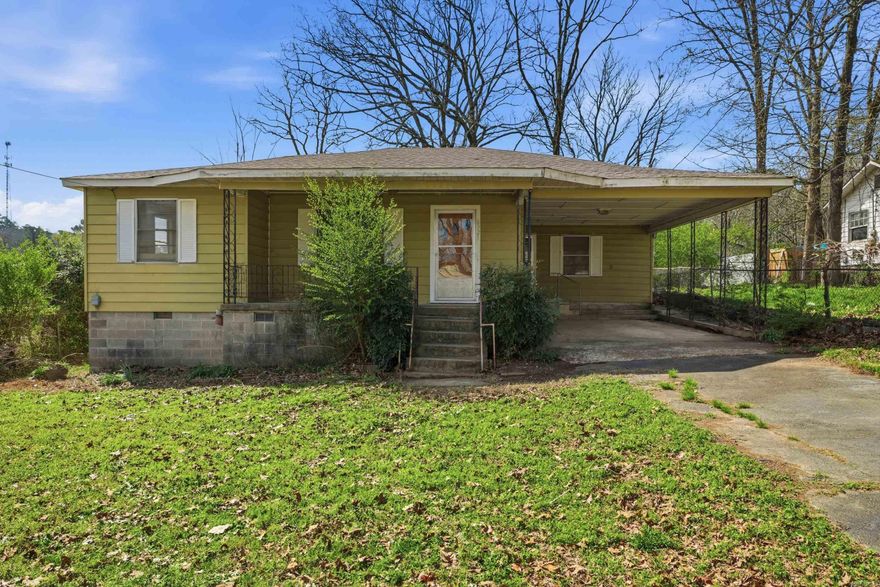 If you’ve been searching for a property with character, space, and potential, this may be the one. Set on a beautiful lot with mature trees and a fenced backyard area, this home offers a roomy living area, separate dining room, expansive kitchen, covered carport, and outdoor storage. The Kitchen sits in the center of the home with tons of cabinet and counterspace. The interior is ready for updates, making it a great option for someone wanting to renovate, invest, or create a home that reflects their own style. New Roof October 2023, Newer HVAC- Approx. 5 years Old