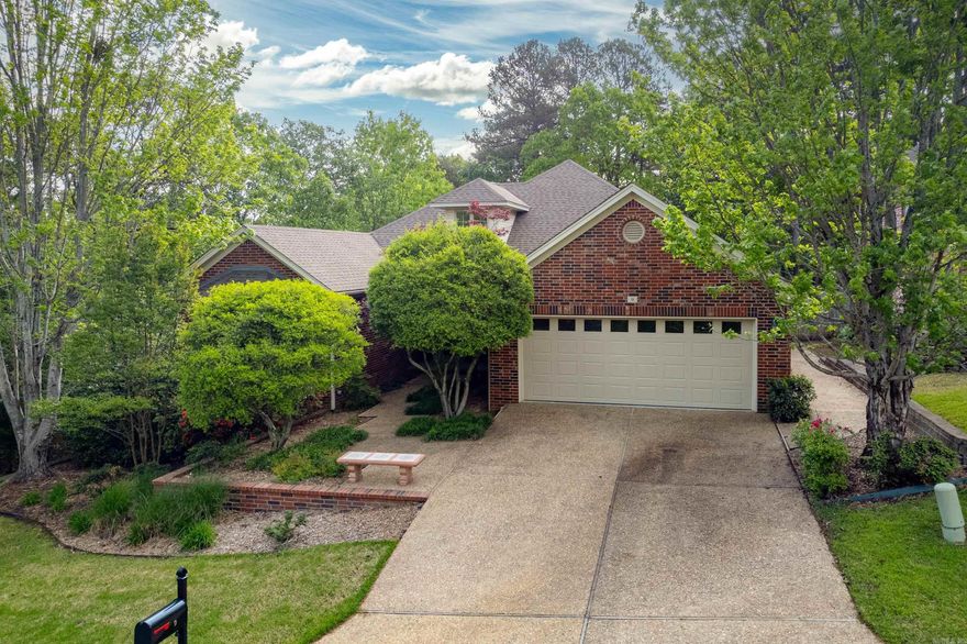 This incredible Chenal Valley home has been masterfully renovated and remodeled! From quartz countertops in the kitchen and baths to new flooring & paint throughout, no detail was overlooked. Handsome landscaping welcomes you in to this two story gem that lives like a one-level home. Spa-inspired primary suite includes a soaking tub and walk-in rain shower with pebbled flooring and all new tile throughout.  3 additional bedrooms away from primary + bonus game room/office/full bath up. Open concept kitchen/living with a lovely nook by the gas fireplace for either a breakfast table or additional living space. Stainless steel appliances. Windows cover the back of the home looking out to a deck with multiple spaces for entertaining & dining.  This super peaceful home backs to woods and green space.  Don't miss the additional carpeted closet/storage up & the full-size shop down below! This one won't last long!