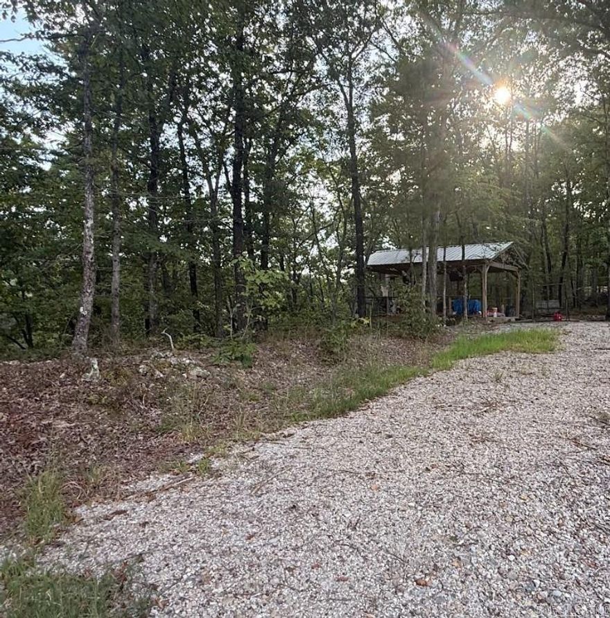 This Crystal Mountain acreage is the perfect place to build your Lake Ouachita retreat! Surrounded by mountain views and mature pines, you can hear the seasonal, babbling Murphy Creek below at this slice of heaven. Imagine heading back to your sanctuary after a long day of fishing, skiing, wakeboarding, or paddling at Lake Ouachita. Just 10 minutes to Crystal Springs Marina, 12 minutes to Mountain Harbor. Although the property feels miles from civilization, there is quick access to 270 for convenient travel. Located just outside the prestigious Woodland Springs private community. Seasonal creek flows through lower part of property Power onsite, Septic/Water will be needed.