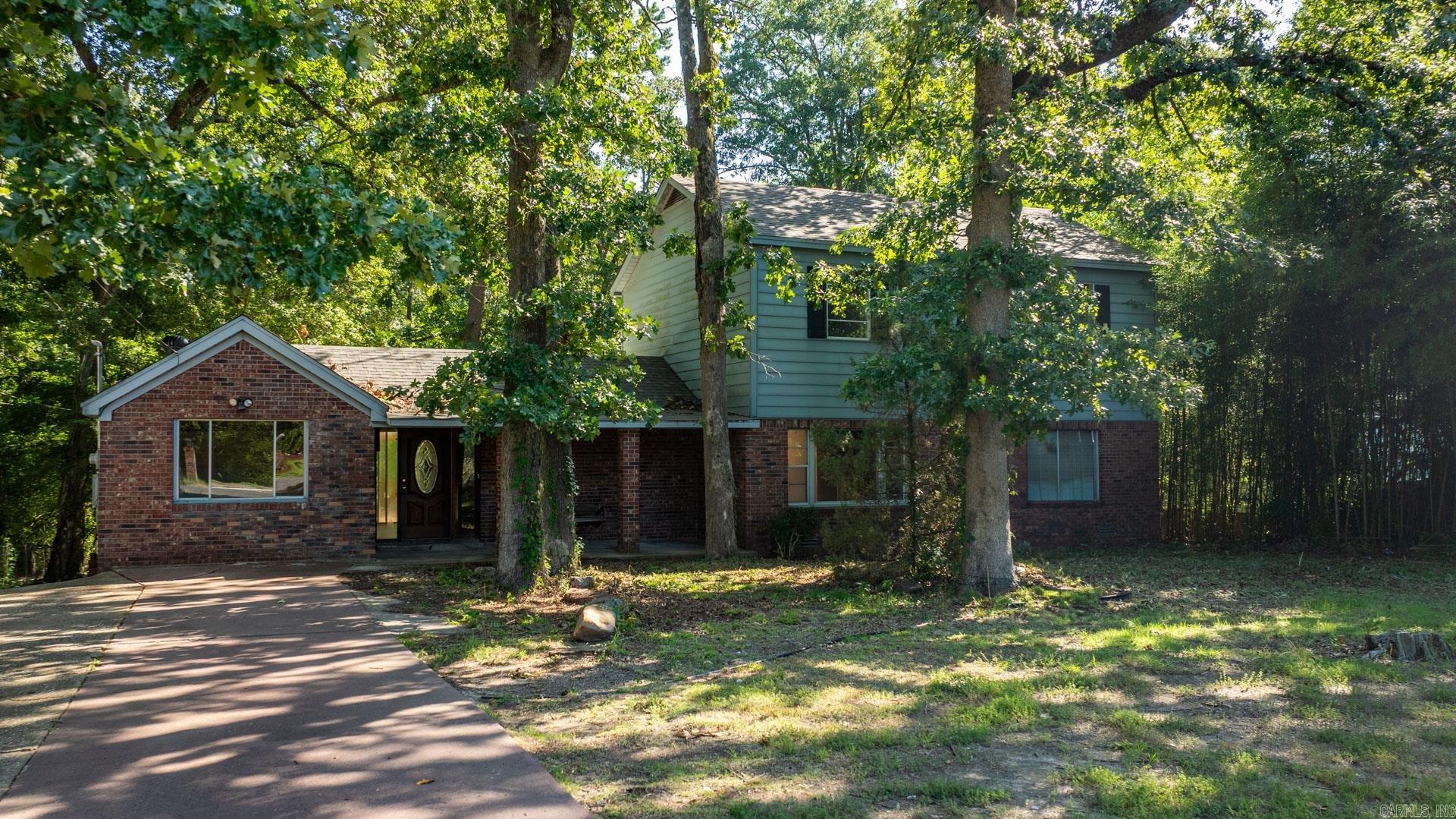 Introducing a rare opportunity in Little Rockāthis remodeled 5-bedroom, 3-bathroom home is listed just below $200,000, making it a fantastic find for large families on a budget or investors! Nestled on a generous 1.14-acre private lot, the property has an extended concrete pad to the back side for extra parkings. Completely upgraded in 2024, featuring a new architectural shingle roof; LVP and hardwood flooring in the living room, kitchen, dinning areas, and downstair bedrooms; fresh paint throughout. The layout includes two spacious bedrooms on the main floor and three additional bedrooms upstairs, complemented by two living areas. A standout feature is the solid hardwood staircase, adding elegance to the space. Enjoy outdoor gatherings on the large deck, perfect for family entertainment, and the expansive front porch offers the perfect setting to savor your morning coffee. With a new HVAC system for the downstairs and a new AC condenser for the upstairs, newer dishwasher, newer fixtures, brick and vinyl siding, this home combines comfort and low maintenance in an exceptional package! Donāt miss out on this gem!