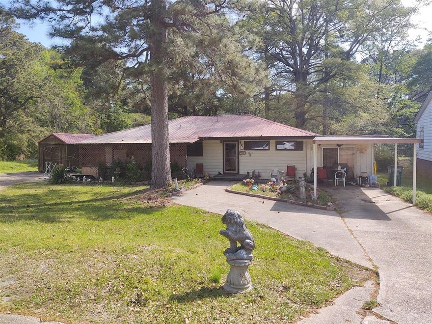 This home is located on 7 city lots totaling over an acre of land.    Storage building does not convey.
