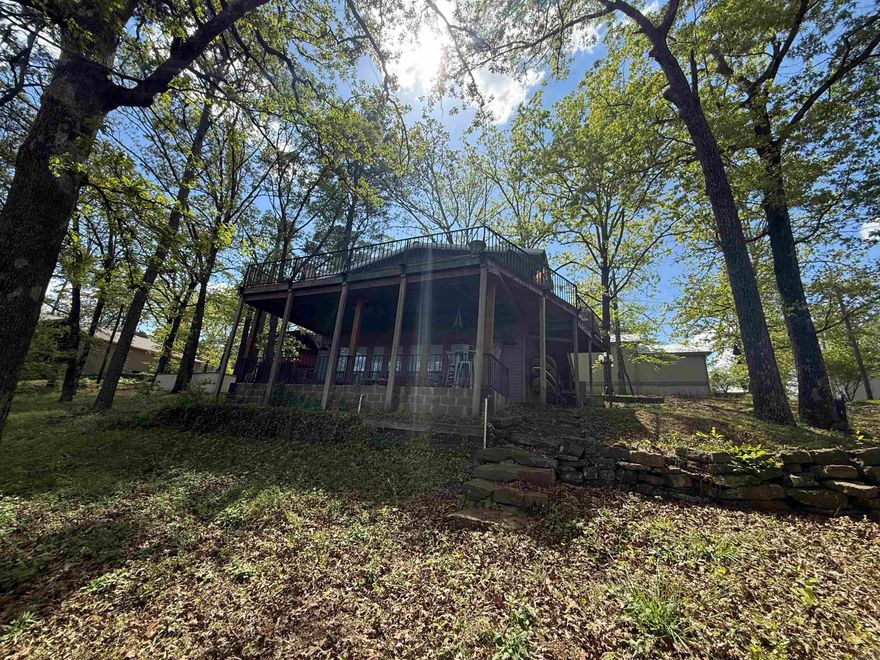 LAKEFRONT. AWESOME VIEW. EASY WALK TO THE WATER. GORGEOUS SHORELINE. What more can you ask for?! This HOME is perfect for weekend lake life with friends and family or full time LIVING. Don't let the age of the home fool you. The owner has made many updates throughout, including external HVAC system less than 10 years old.  The large upper deck is perfect for entertaining and enjoying the beautiful view of the lake and the lower patio is just the area needed for enjoying your morning coffee. The large 70x21 ft shop has plenty of room for storing all your lake toys. Pictures do not do this place justice.