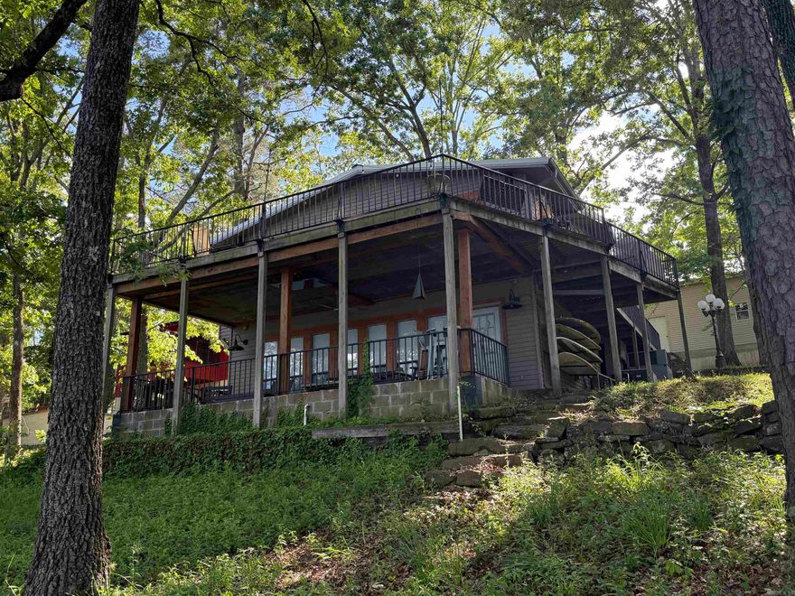 LAKEFRONT. AWESOME VIEW. EASY WALK TO THE WATER. GORGEOUS SHORELINE. What more can you ask for?! This HOME is perfect for weekend lake life with friends and family or full time LIVING. Don't let the age of the home fool you. The owner has made many updates throughout, including external HVAC system less than 10 years old.  The large upper deck is perfect for entertaining and enjoying the beautiful view of the lake and the lower patio is just the area needed for enjoying your morning coffee. The large 70x21 ft shop has plenty of room for storing all your lake toys. Pictures do not do this place justice.