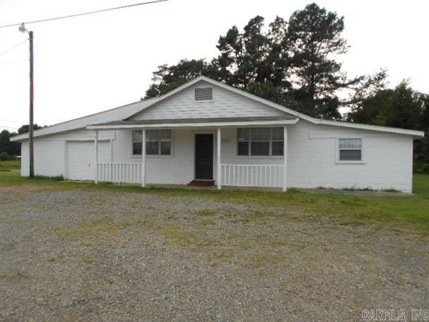 Great older 4 bedroom 2 bath home out of city limits.  Plus 600 sq ft of storage area.