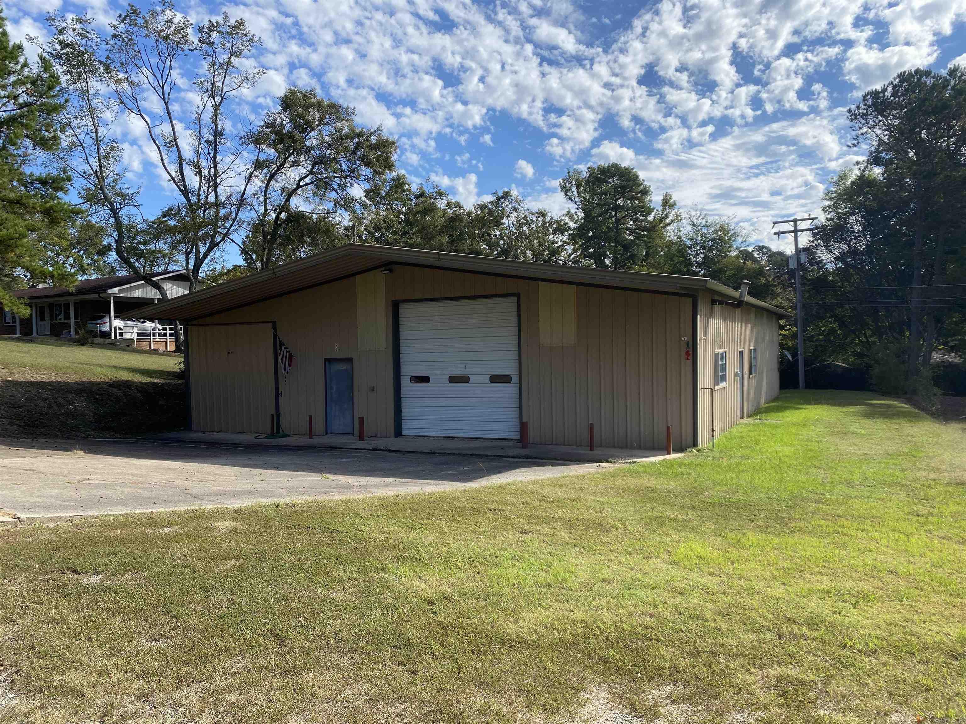 Great spot to build your business! Room for everything in this 2884 square foot metal building located in Mount Ida situated on 2.86 acres more or less. The building includes two 12' overhead doors making it easy to "drive thru" with your equipment or cars, three phase power, insulated, basically new HVAC, and mini-split unit in the office space. Property has city utilities. There are so many possibilities on this land and building. Call today! $150,000.00