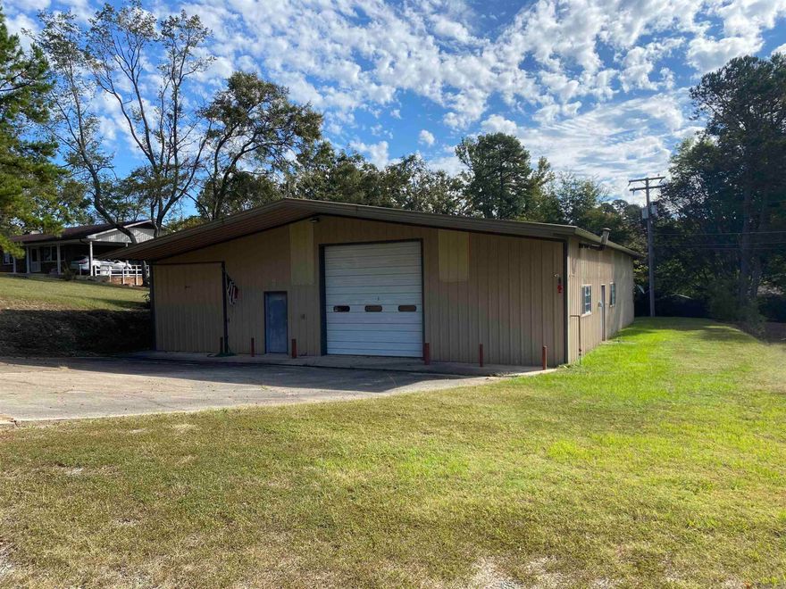 Great spot to build your business!  Room for everything in this 2884 square foot metal building located in Mount Ida situated on 2.86 acres more or less. The building includes two 12' overhead doors making it easy to "drive thru" with your equipment or cars, three phase power, insulated, basically new HVAC, and mini-split unit in the office space. Property has city utilities.  There are so many possibilities on this land and building.  Call today!  $150,000.00