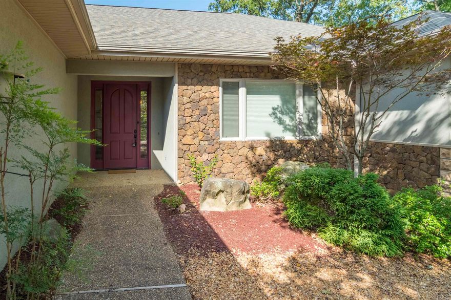 Cottage in the woods with a mountain view.  This home offers lots of features people look for in their forever home.  High volume ceilings, 3 bdrms-2 1/2 baths, wood, carpet, tile flooring. Kitchen-dining combined, screened and open porches, floor to ceiling glass -office/study with built ins, split bedrooms for guest privacy, Oversize garage with stg. area-approx. 2206 sq ft. built in 2007. Priced at $359,500.