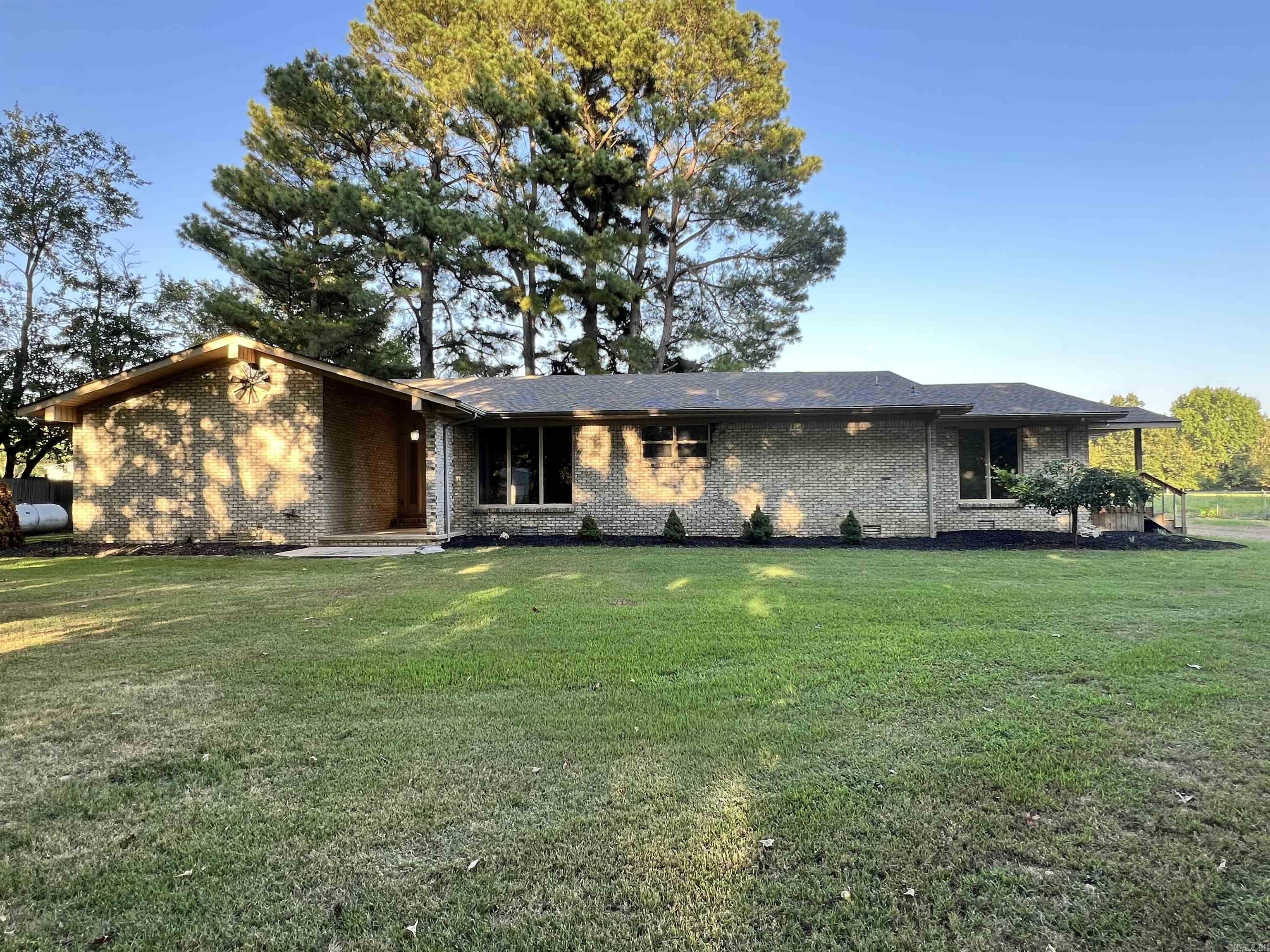 Welcome to this beautifully maintained 2,216 sq ft residence nestled on an expansive 1.16-acre lot, all within city limits. This spacious 3-bedroom, 2-bathroom home offers the perfect blend of privacy and convenience.