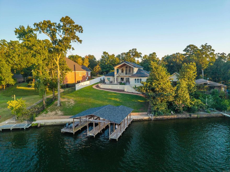 Enjoy year-round resort living in this one of a kind lakefront retreat! Designed for the entertainer at heart, this contemporary home offers a heated and cooled poolside cabana with a roll-up glass door, a stationary double boat dock with swim platform, and and open floor plan perfect for gatherings. Situated on nearly an acre with 100 feet of lake frontage, it showcases main channel views you'll never want to leave. Call today to schedule your private showing.