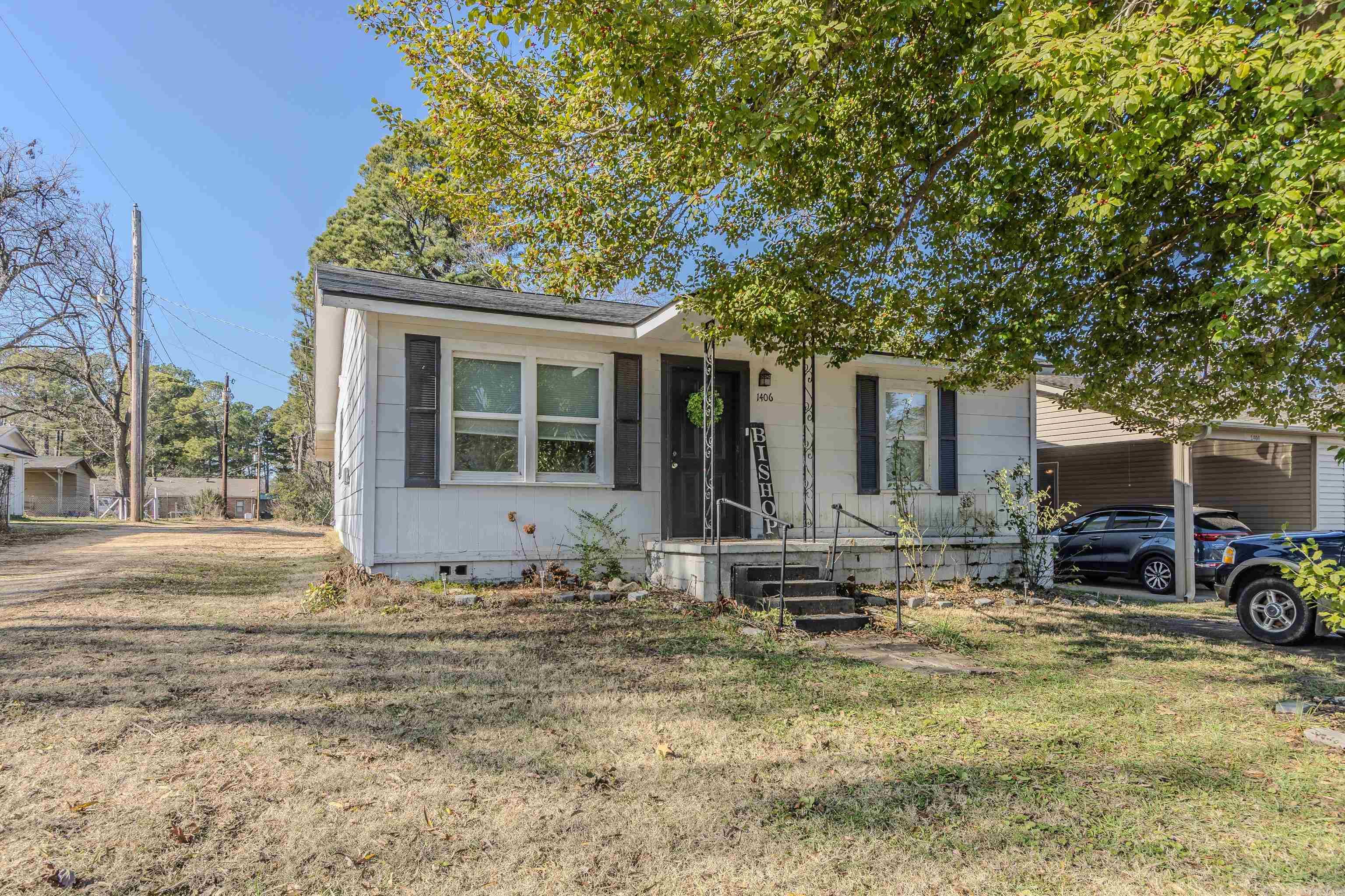 Welcome to the market, 1406 S 9th Street in Paragould, Arkansas! This cottage-style cutie features two large bedrooms, two full bathrooms, a large living area open to eat-in kitchen, a full utility room, and carport with storage! This all electric home has been well maintained and updated, and is move-in ready for its new owners with electric and HVAC replaced in 2018, new plumbing completed in 2021, and a BRAND NEW roof December 2024! Plenty of room for guest parking, enjoy gardening and/or entertaining in the backyard, front porch sit and visit with your neighbors, or enjoy secluded relaxation in the storage room-turned-mancave off the back carport - the possibilities are endless here! Inside you will be pleasantly surprised with an oversized primary suite that is large enough for a sitting area for additional living space, and even boasts TWO large closets! The secondary bedroom is also generously sized and would make the perfect guest bedroom, playroom, nursery, gameroom, home office, or even craft room! Did I mention the appliances convey to new owners?! Save your out of pocket expenses and build your equity!