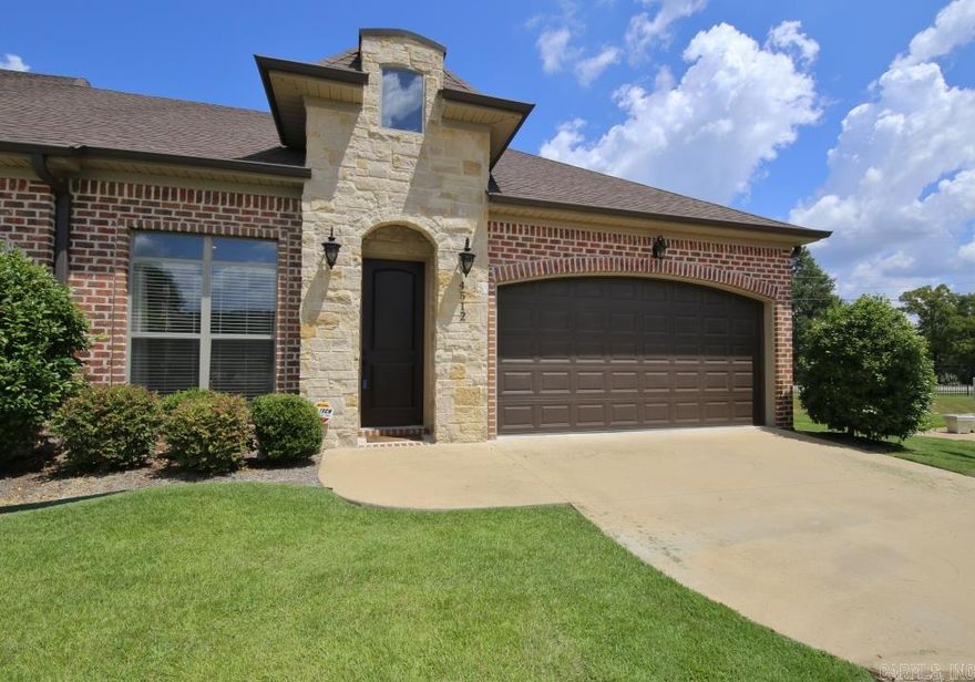 Beautiful 4-yr old brick patio home tucked away in a quiet neighborhood in West LR. 10' ceilings, 8' doors, distressed hardwood flooring, granite countertops, gas range, built-in microwave, FP w/gas logs. Current DR could also be office/study/3rd BR. Upstairs guest BR has a huge walk-in closet as well as access to a huge, floored walk-out attic. POA monthly dues cover garbage pick-up & grounds maintenance, so you'll never have to mow your lawn again! Close to Roberts Elementary!  Refrigerator neg. Come see!