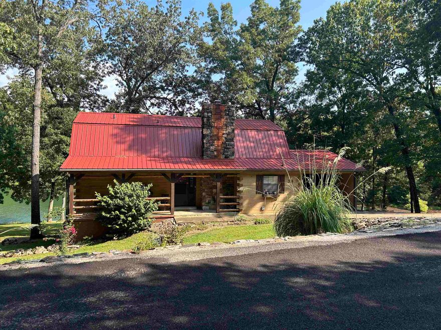 Sitting on 5 lots and nestled into the wooded area with over 350 feet of shoreline on beautiful Lake Aztec your escape awaits! This 3 bedroom 2 bath log home is a one of a kind.  Updated with new flooring and lighting throughout, new countertops in the kitchen and new HVAC this one is ready for living & entertaining. Enjoy the 2 large decks one covered one open, a dock with a slide and a great water side shed to house all your lake toys. The main level boasts a beautiful master suite, guest bath laundry & pantry room and the upstairs has 2 nice size bedrooms roomy closets and an additional new bathroom. The gently sloping back yard has room to play and gather. A very popular nightly rental. Call today to take a look at this one of a kind get away!  Perfect to make your home or vacation stay.