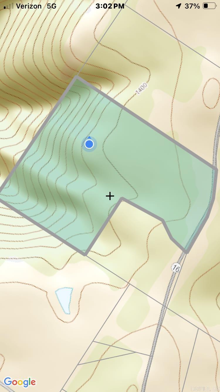 This is a very nice piece of land! Beautiful spot to build or set a mobile. Unrestricted property with power, well water and municipal available. Property and structure being sold as is. Prepare to do some clean up and you will have beautiful place to live. Call today for an appt. Shown only with an agent.