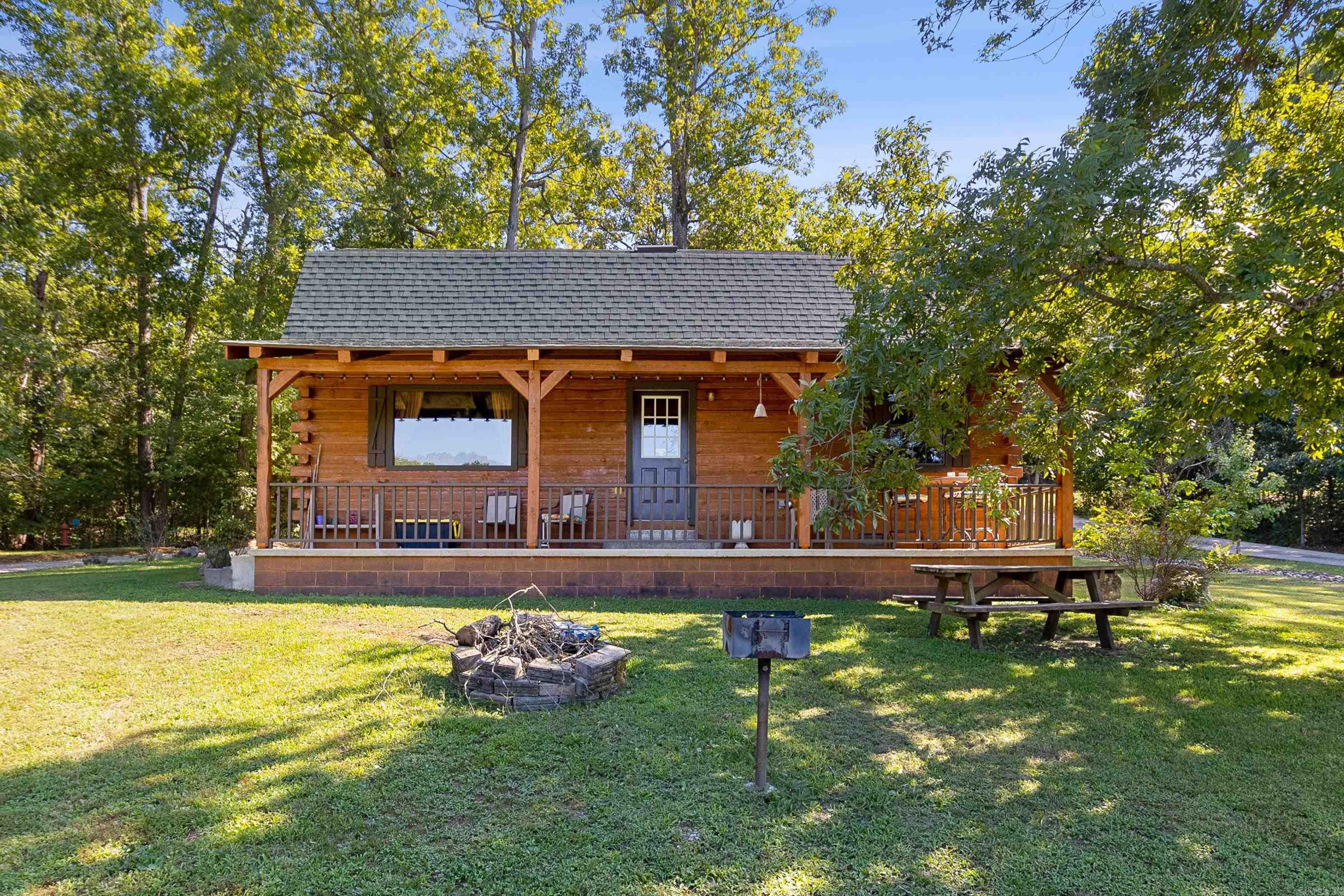 Step into your very own piece of paradise with this stunning 15.11-acre riverfront property nestled along the tranquil South Fork River in Cherokee Village. This exceptional parcel comes complete with two charming, fully furnished cabins, each featuring 2 bedrooms, 1.5 baths, and a versatile loft room that could easily serve as a third bedroom. Currently thriving as lucrative short-term rentals, these cabins offer a turnkey opportunity for immediate income. Beyond the existing cabins, the expansive land offers boundless possibilities. Envision a new river cabin to complement the current ones or embark on a development project to build a collection of exquisite riverfront properties. The āSerenity Nature Trailā meanders along the bank of the river, perfect for peaceful walks with opportunities for fishing along the way. Cherokee Village, a year-round destination, enhances this propertyās appeal with its impressive array of amenities: 2 championship golf courses, 7 pristine lakes, 3 recreation centers, and 6 sparkling swimming pools. This is a rare opportunity to own not just a slice of nature but a gateway to creating something truly exceptional.