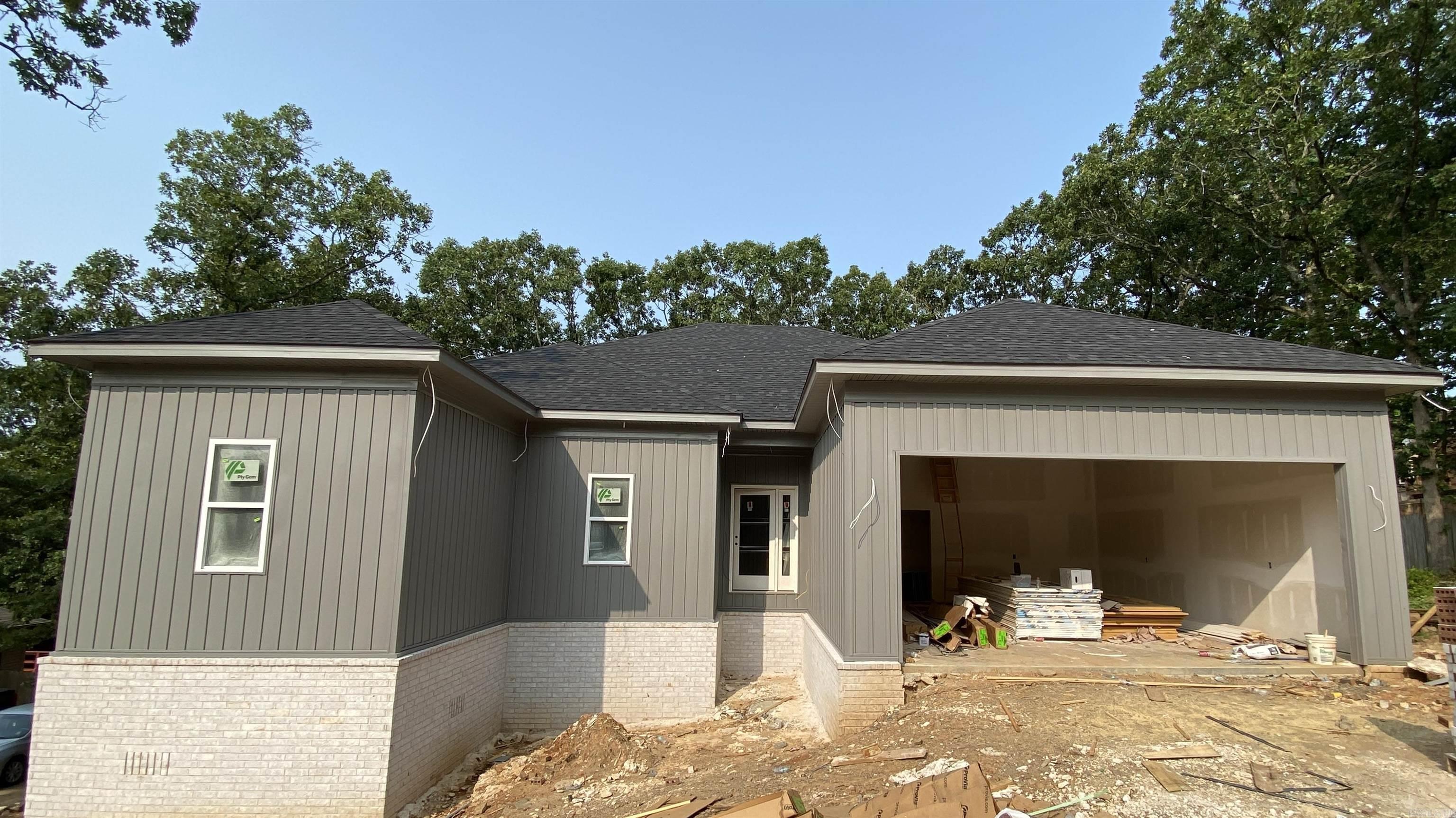 Nearing Completion on this Brand New Construction in Sherwood! This beautiful 4 bed, 2 bath home offers style, space, and upgrades ā all under $300K. You will not find these type of finishes in any NEW home at this price! Step into a bright living room with soaring ceilings, an upgraded fireplace, and a wall of windows for natural light. The kitchen features floor-to-ceiling cabinetry, granite countertops, and stainless appliances, opening to a covered deck overlooking the large backyard. Split floor plan with a private primary suite, complete with a double vanity, tiled walk-in shower, soaking tub, extra storage, and a spacious walk-in closet. Three additional bedrooms share a full bath. Laundry room off the primary bedroom and a 2-car garage. Upgraded spray foam insulation to help with energy costs. Why settle for used when you can buy new? Stop by and check out the progress on this gorgeous home today!