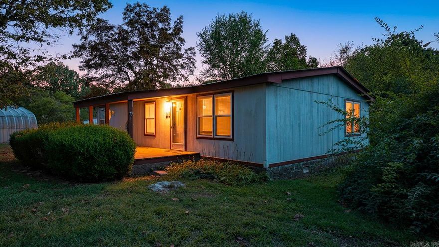 This rare opportunity features two homes on 20 scenic acres, just minutes from Mammoth Spring, Arkansas. Perfect for multi-generational living, guest housing, or rental income, the property offers flexibility and comfort in a serene Ozark setting. The first home sits on 11.92 acres with 2 bedrooms, 2 baths, and a bonus room that can serve as a third bedroom, office, or hobby space. Vaulted ceilings highlight the open living area, while the kitchen offers ample cabinetry and counter space. Enjoy central heat/air, a covered porch, fenced pasture, two outbuildings, and a heated/cooled shop with a concrete storm shelter. The second home, on the remaining acreage, is a freshly updated 2-bedroom, 1-bath residence with new paint, LVP flooring, and a remodeled bath. Features include central heat/air, a washer/dryer, refrigerator, oven, and low-maintenance metal roof. Outside, find a fenced garden, producing apple tree, walnut trees, and a large backyard. A 24x30 heated/cooled shop with lean-to adds storage and workspace. Just minutes to Spring River and Mammoth Spring State Park.