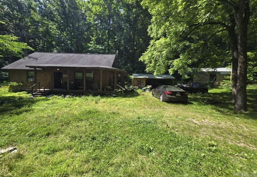 Escape to the folk music capital of the world with this charming log cabin built in 2010, perfectly nestled on 10 acres of serene Ozark privacy. Boasting 2 bedrooms and 1.5 baths, this property features exceptionally solid bones and is just waiting for a little TLC to truly shine. It is the ultimate canvas for a weekend getaway, located just minutes from the vibrant live music of the Mountain View Courthouse Square, the scenic hiking trails of the Ozark National Forest, and world-class trout fishing on the White River. Whether you want to explore Blanchard Springs Caverns or unwind in nature, this property is being sold completely as-is, offering the rare freedom to bring your own ideas and make it completely your own.