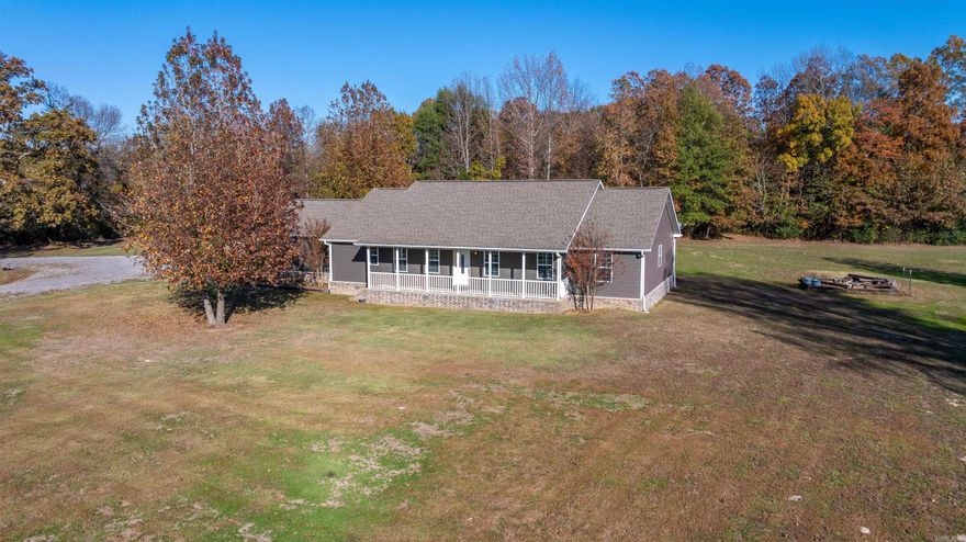 WELCOME TO 497 MCHUE RD — WHERE LUXURY MEETS COUNTRY LIVING! This BEAUTIFUL 5 BED, 3 BATH HOME sits on 3 m/l ACRES with a STUNNING DRIVEWAY ENTRANCE and peaceful setting. Built in 2017 BY DEWAYNE HOOKER with 2X6 EXTERIOR OUTER WALLS, this home showcases QUALITY CRAFTSMANSHIP throughout. Enjoy an OPEN FLOOR PLAN, CUSTOM CABINETS, REFRIGERATOR, BRAND NEW DISHWASHER, and STOVE INCLUDED! Relax on the FRONT AND BACK PORCHES, outside fireplace, or take advantage of the 2-CAR GARAGE and NEW 31X31 CONCRETE SLAB poured already for your future SHOP. Featuring a RAIN SOFT WATER SOFTENER, EXTERIOR LIGHTING, LARGE GUN SAFE THAT CONVEYS, and pride of ownership — this MOVE-IN READY HOME truly has it all: COMFORT, STYLE, AND SPACE! Call or text today for a tour!