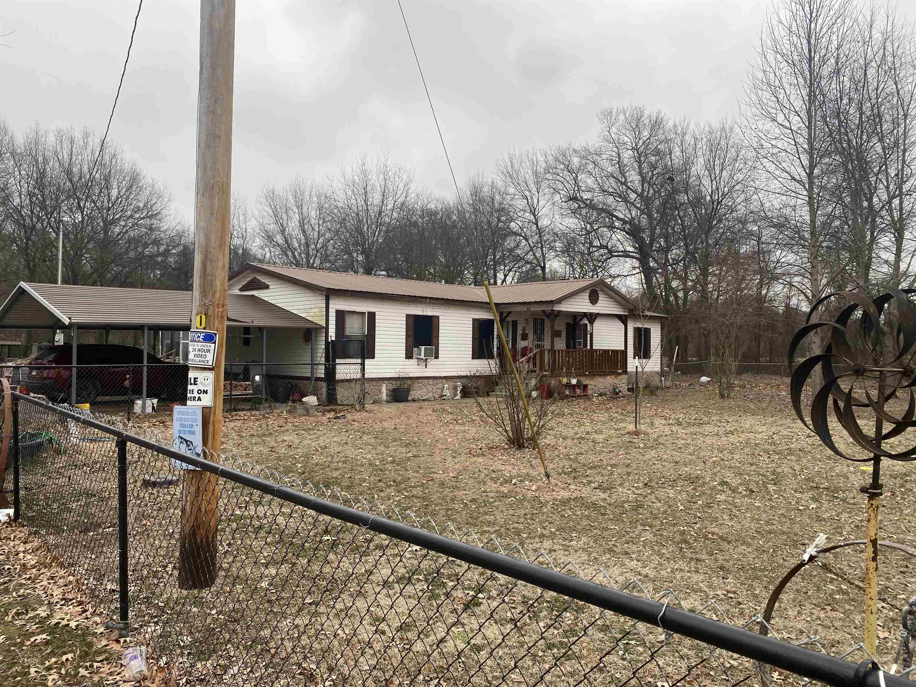 3 bedroom, 2 bath 1995 manufactured home on 2 acres with a detached 2 car carport. Great spot for a garden and chickens. The home is at the end of the road and offers privacy. The home has a metal roof, split floor plan, 2nd living area with a woodturning stove.