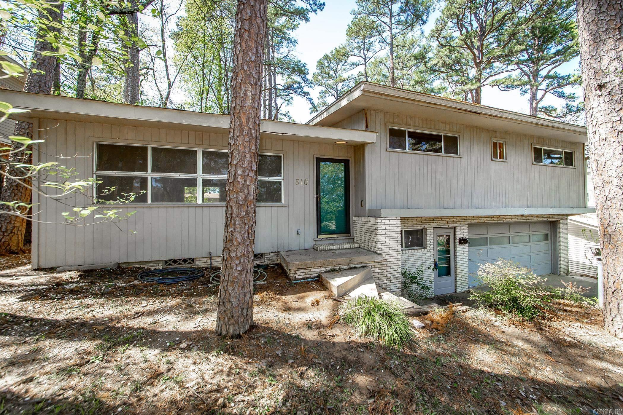 Looking for a Nostalgic, Mid-Century Modern home with lots of potential? Check out this 4-bedroom 3 Bathroom home with Bonus/office space, Original Hardwood floors, Original Broken Quarry Tile floor, Garage, fully fenced backyard, French Drains installed 2020, New deck off of Primary Bedroom 2022. Schedule your showing today!