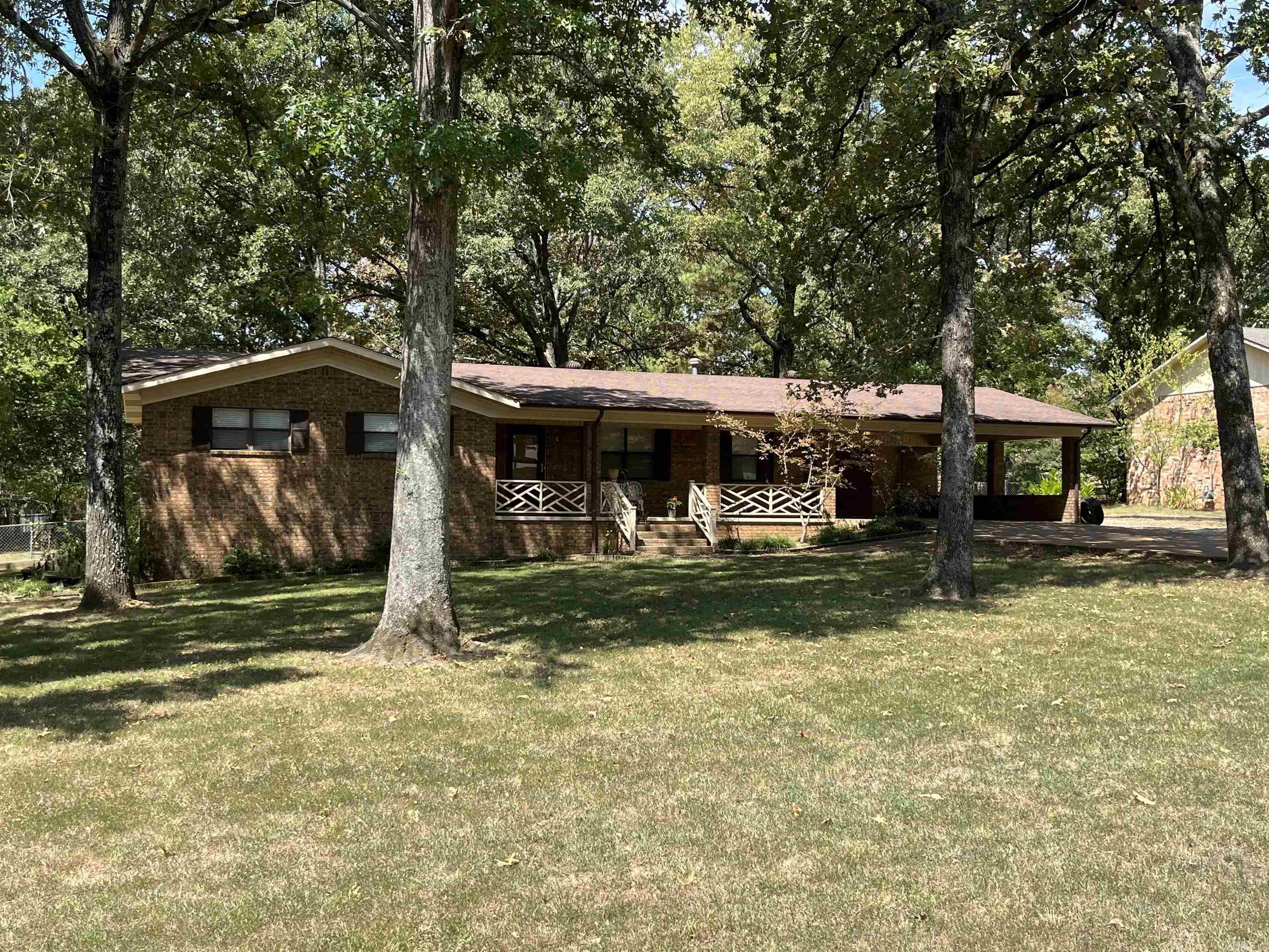 Welcome home to one of Batesville’s most loved neighborhoods—famous for trick-or-treating and family fun year-round! This 3 bedroom, 2 bath brick home sits on a spacious ½-acre lot with a fenced backyard that’s perfect for kids, pets, or backyard gatherings. Inside, you’ll love the low-maintenance LVP flooring, large laundry room, and a separate dining area made for family meals and hosting guests. The double carport offers convenience, while the bonus storage room is the perfect spot for a craft room, home office, or hobby space. Priced to sell—this one won’t last long!