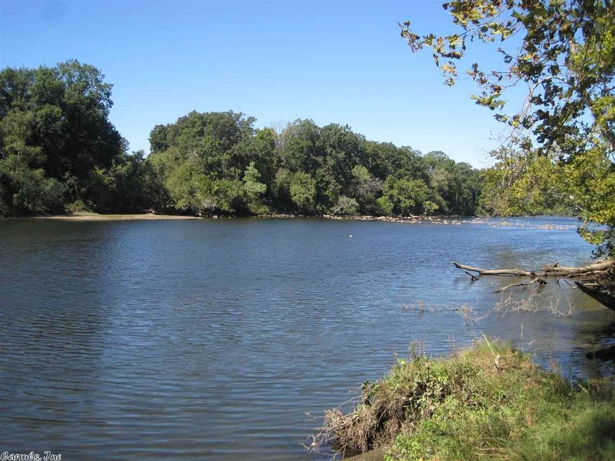 Beautifully wooded level home-site with 210 ft. Ouachita River frontage.  Located inside gate Riverview Sub. you will find a quiet location with deer, fishing, and canoeing.  Convenient to Hot Springs, Malvern, and Little Rock, shopping, but serine rural living with all the amenities.  Paved roads, public water, high speed internet.  Great convenient place to live or enjoy on weekends.