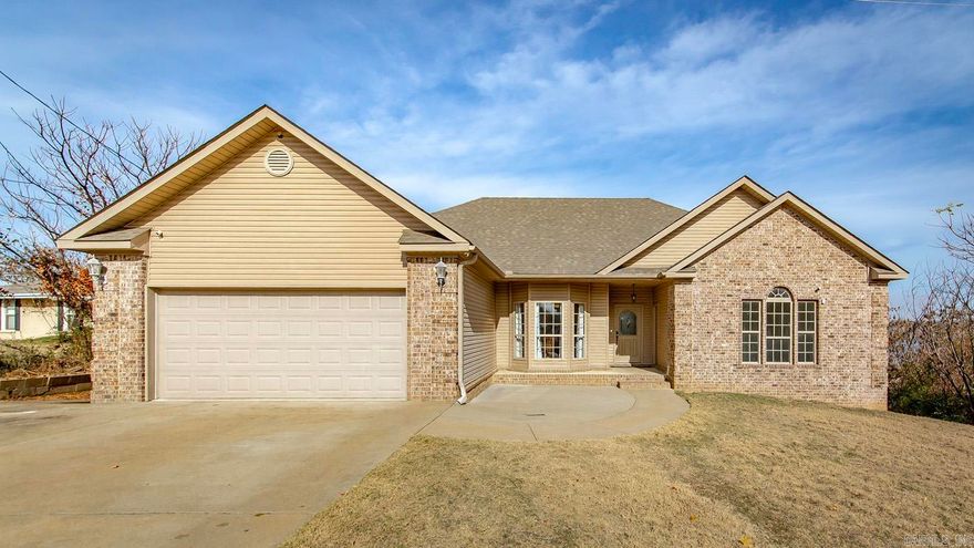 All electric home located on Lake Conway with the Best View of the Lake- Relax in the evenings on the back covered deck overlooking the lake and check out the view from the front porch. This Smart Home is ready for new owners with 4 bedrooms 3 full bathrooms and a spacious walk-out basement/storm room/safe room designed to withstand any weather with a full kitchenette and bathroom (could be 5th bedroom or studio space). Smart home updates include automated door locks, controlled thermostat, lamp modules and garage door that make it easy to operate the home from anywhere. New Architectural Roof in April 2022, Fresh Paint, Hardwood floors in the main area. Kitchen features Granite Countertops and a New Stove and New Dishwasher. Fiber Internet and an additional outside door at the front of the home make working from home a breeze. CCTV Camera System Equipment Conveys. House designed to accommodate handicap accessible needs. Existing Boathouse on property and the Lake Conway Renovation project is a Great opportunity to build a new dock and any other shoreline projects that you have in mind.