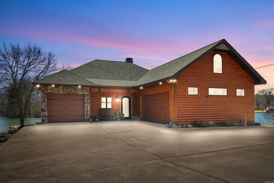 Located on the serene shores of Lake Hamilton, 168 Golden Oak Place offers an unparalleled opportunity to own a custom-built home with 642 feet of stunning lakefront shoreline. Designed by renowned builder Tony Usdrowski, this home features Knotty Alderwood custom cabinets throughout, adding rustic charm and warmth to the spacious kitchen. The property also includes a Tornado room, providing peace of mind in extreme weather, and a high-pressure spigot for efficiency with outdoor tasks. The home faces south, offering breathtaking sunrises and sunsets while avoiding the harsh afternoon sun from the west. Inside, 9' interior doors add to the airy, open feel. Premium KitchenAid appliances elevate the kitchen into a chef’s dream, and a two-stall boat slip with lift provides easy access to the lake.  With 642 feet of shoreline, this lakefront retreat is perfect for boating, fishing, or simply relaxing on the water. Don’t miss your chance to make it yours!