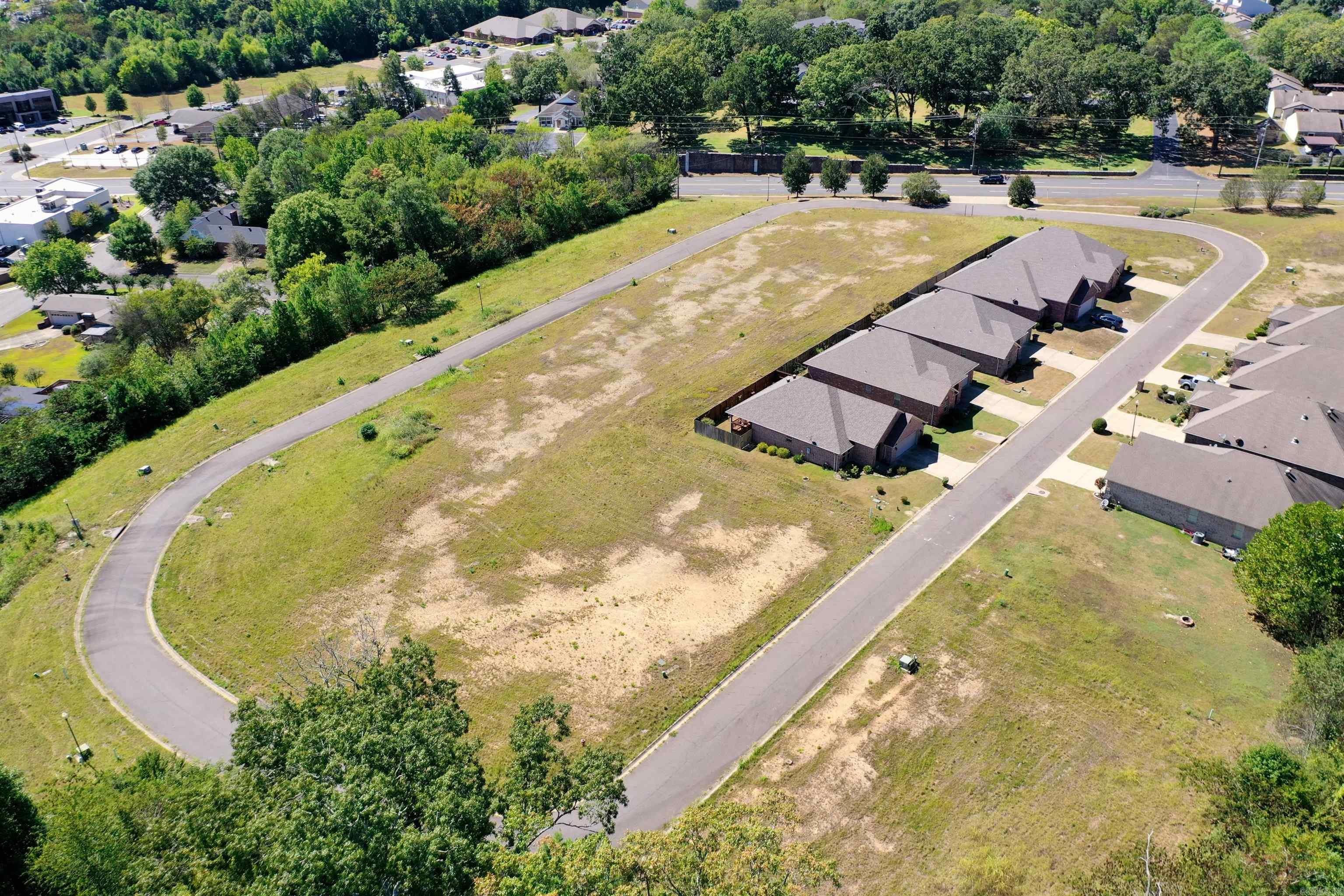 Attention Builders and Developers! Opportunity to purchase 34 lots in established Autumn Ridge Subdivision. Convenient area near shopping (1/2 mile), National Park Medical Center/hospital/clinics (1/2 mile), Hot Springs Country Club/golf (1 mile), Oaklawn Racing Casino Resort (1.5 mile), Historic Bathhouse Row (2 miles), and Garland County Library (1/2 mile). Beautiful, mostly level lots. Utilities are underground and stubbed to each lot, with curbs and gutters in place.Streets and street lights are maintained by the City of Hot Springs. Ready to build! Through LLC, Seller is an Arkansas licensed real estate broker.