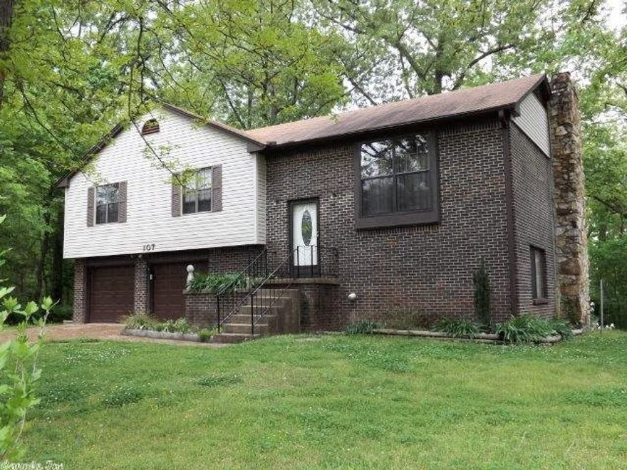 VERY NICE BRICK HOME PRICED TO SELL!  This family friendly home offers 3 bedrooms, king-sized master, 2 1/2 baths, country kitchen with updated stove, refrigerator, dishwasher, and built-in microwave, good sized family room downstairs with gas log fireplace, double pane windows, 2014 central heat and air, 8x34 covered deck overlooking the level backyard, and a patio below. The interior is drywall, flooring is carpet, laminate, vinyl and stone tile, and the home has a wonderful two-car garage with shop area.