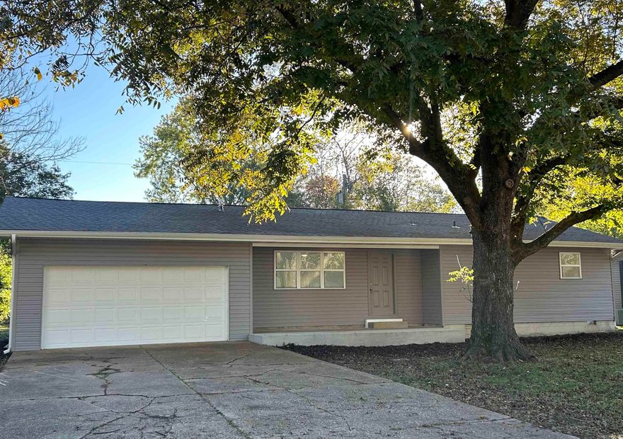 This move-in ready 3 bed, 2 bath home features numerous updates including new siding, deck, LVP flooring, bathrooms, kitchen cabinets, stone countertops, stainless steel appliances, windows, doors, and fresh paint. Roof shingles are approximately 3 years old, and HVAC is approximately 2 years old. The primary bedroom offers double closets and an ensuite bath. Additional features include a two-car garage, fenced backyard, and extra closet space with built-in shelving.