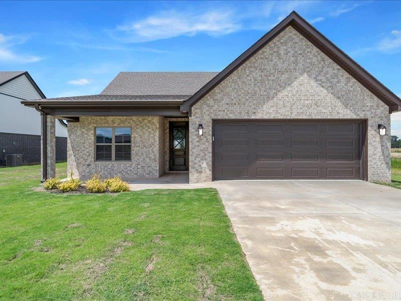 This brand new three-bedroom, two-bath home in Manila, Arkansas, offers a perfect blend of modern design and rustic charm. As you enter, you're greeted by an expansive open concept living area where a striking large beam adds warmth and character to the space. The beam creates an eye-catching focal point in the main living space, giving the home a welcoming, open feel that is perfect for both family gatherings and relaxing evenings. The sleek, contemporary kitchen features high-end appliances, plenty of cabinet storage, and a stylish island that offers additional counter space for cooking and entertaining. The seamless flow from the kitchen into the dining and living areas ensures that every part of the home feels connected and spacious. The master bedroom is a serene retreat, complete with an en-suite bathroom featuring modern fixtures and a beautifully designed shower. The two additional bedrooms are generously sized and offer flexibility for various uses, such as guest rooms, home offices, or children's rooms. Outside, the home sits on a sizable lot, giving you plenty of space to enjoy the outdoors.