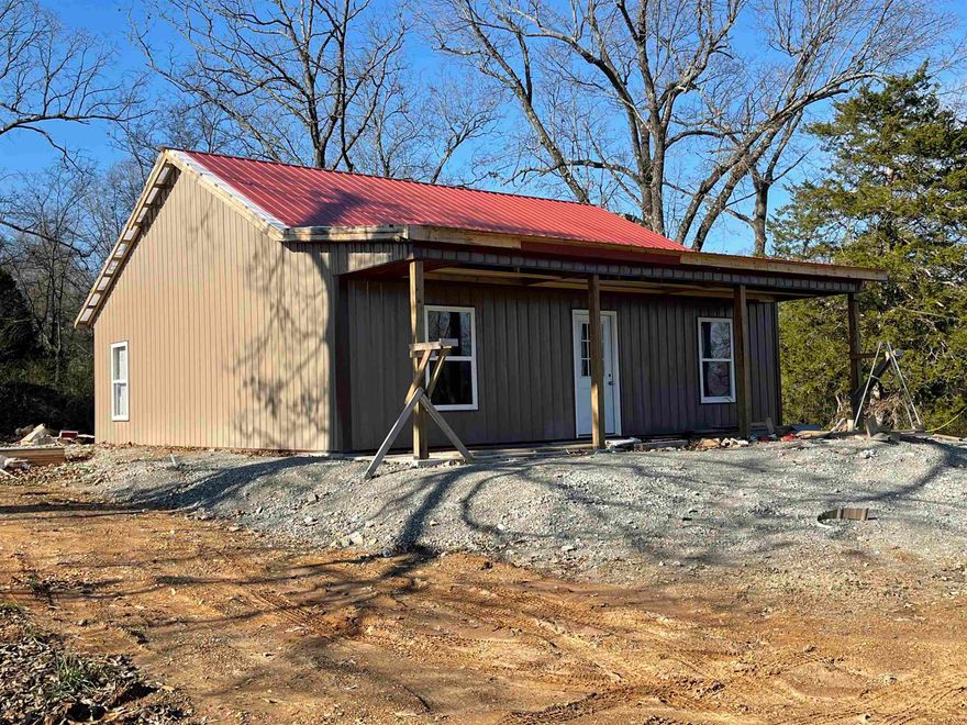 This new construction home is ready for you to finish out however you would like! The seller has gotten water and electricity on the property. The sheetrock has not been put up yet, so you have the option to move the walls, and design the home to your liking.  The property consists of 3.351 surveyed acres, outside of the city limits.  There is enough ground to build another home as well.  Some of the things that are still needed include a septic, insulation, and electricity ran throughout the home.  Text or call to take a look at this home today!