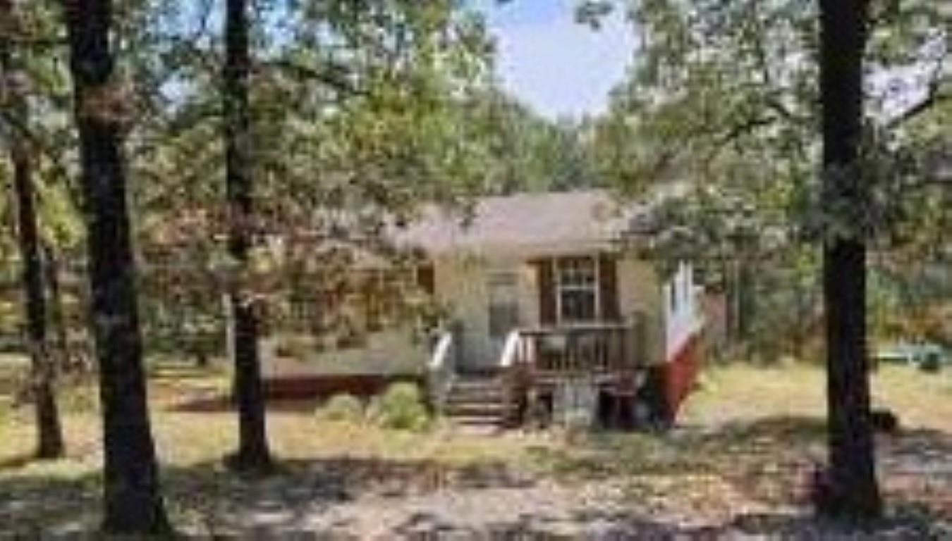 Adorable cottage at the end of a paved road in a country setting. 3+/- acres accompany this 2 bedroom home with 2 sturdy decks. Bedroom closets are large and contain built ins. Outbuilding conveys--much larger than it looks and has electricity. Plenty of room to build more structures, etc. This property is bank owned. Sells as is, where is, all faults basis. Conveys by SPECIAL WARRANTY DEED. *Arvest employees, directors and their family members are ineligible to purchase Arvest's bank-owned properties. NO DISCLOSURES.