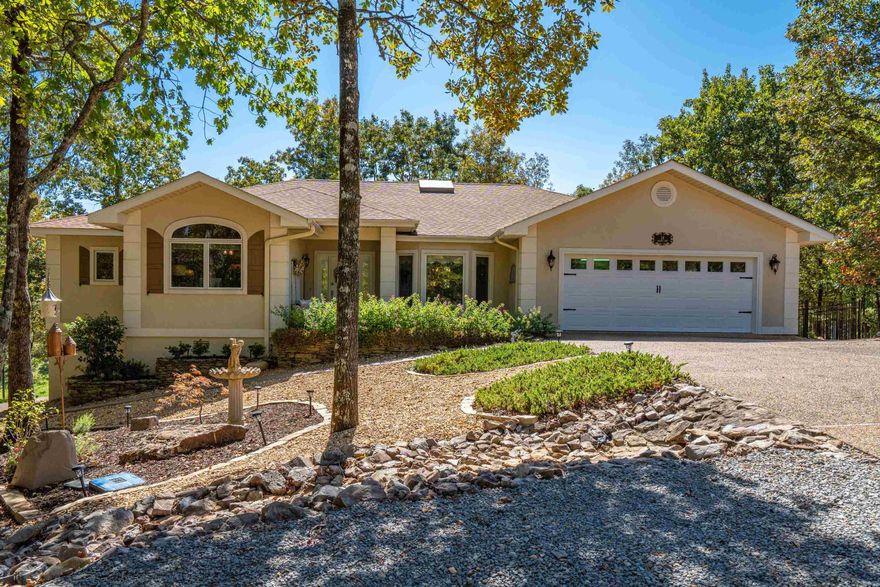 Welcome to your golf course dream home in beautiful Hot Springs Village located on a quiet street at the end of a cul de sac. This stunning 3-bedroom, 2 1/2-bathroom property, as good as new, is waiting for you to make it your own. From the moment you step inside, you will be captivated by the spacious open floor plan that seamlessly flows from the living room to the kitchen and dining area. The perfect space for entertaining friends and family or simply relaxing after a long day. But that's not all, this home boasts a meticulously professionally landscaped yard creating an oasis with a decorative fence for your pet. Imagine enjoying a cup of coffee on your deck watching the golfers and taking in the serene surroundings. Inside, each room offers ample space and natural light, providing comfort and privacy for everyone in the household. Guest bedrooms are designed to be opposite side of primary bedroom for everyone’s privacy. It was perfect when these owners purchased it, but with decorating talent the homeowner added so much more: paint, light fixtures, upgraded cabinetry, exterior features enhancing the curb appeal. Roof was replaced in 2023, H/A in 2021. Approx 2302 sq. ft.