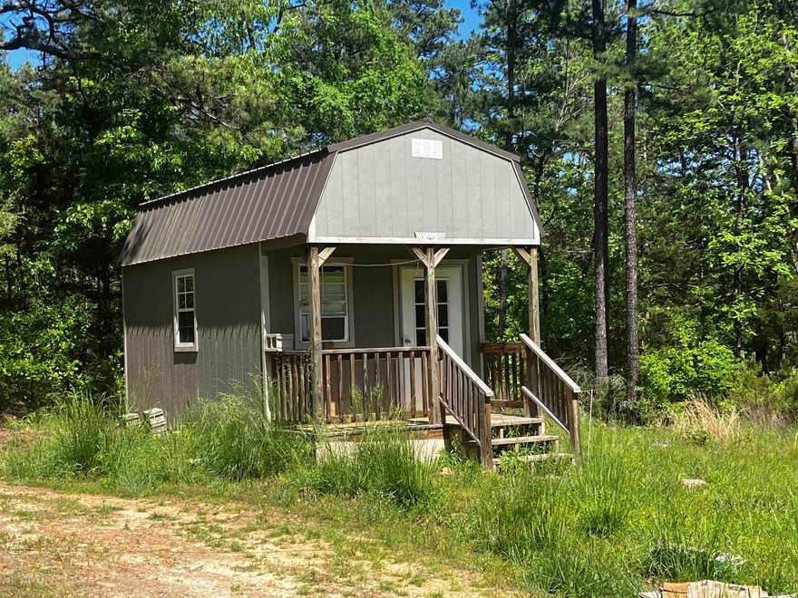 6.48 ACRES M/L CITY WATER WITH WATER METER IN PLACE. SEPTIC, ELEC, 10 X 16 ONE ROOM BUILDING WITH ELEC. MOSTLY WOODED SOME OPEN AREA. OWNER FIAINCING AVAIABLE.