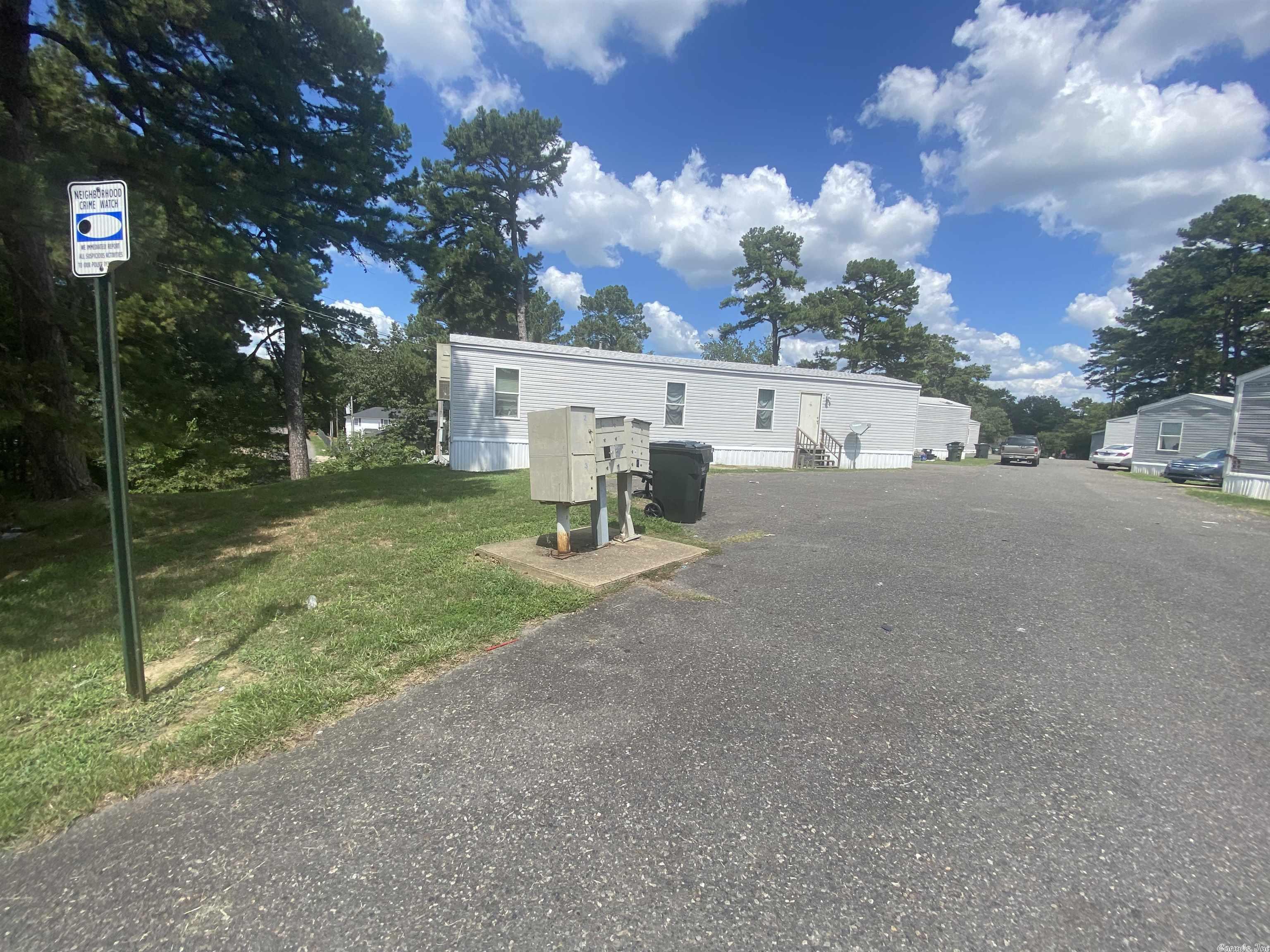 Who wants a MHP? Solid cash flow bringing in over $144k a year! There are 15 newer single wide's in this park plus one empty lot ready for hookup! All homes are 3 bedrooms with rents being no less than $775 on each unit and they are located in LHSD. Owner pays the water bill; tenants pay all other utilities! No portfolio is complete without a trailer park (and they really do bring in the money, this one at the tune of $12k monthly!) Don't miss this deal as there are not many MHP in the area to choose from!