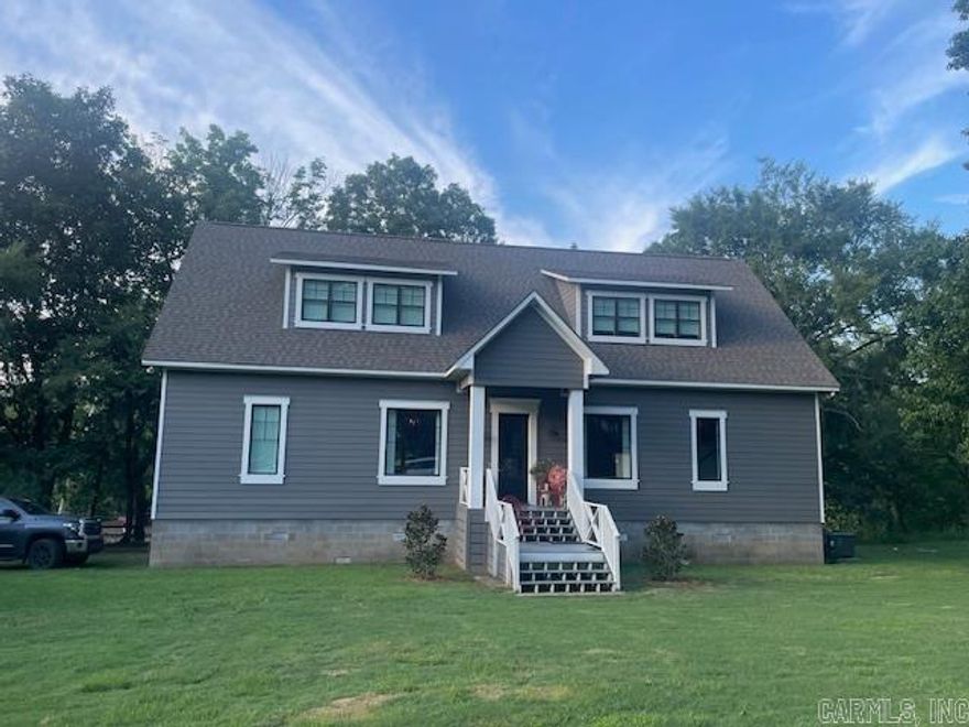 This custom-built home is designed for unforgettable gatherings with an open floor plan, 10' ceilings, and top-tier finishes throughout. The chef’s kitchen features a 6-burner gas cooktop, dual fridge/freezer, double ovens, leathered counters, granite island with prep sink, and a walk-in pantry with a unique antique door. Enjoy river sounds from the screened porch, open deck, or outdoor kitchen. Concrete steps and beautiful railing down tot he river for easy access. Built for low maintenance and durability with Hardy Board siding, composite decking, concrete-filled cinder block foundation, tankless water heaters, and advanced insulation. Bonus: storage room with a toilet for convenience after river adventures. There's too much to list—you must see it!