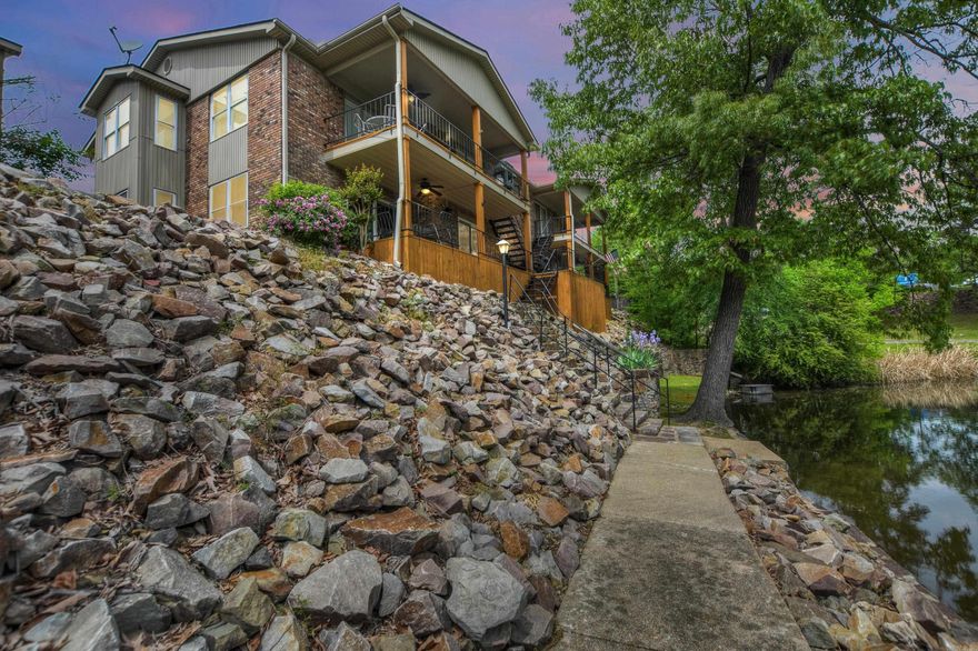 Embrace waterfront living at its finest in this 1,407 sq ft condominium overlooking Lake Hamilton at Westport Bay. Enjoy modern comforts with recent updates including new flooring, kitchen, bathrooms, and more. Relish in the serene views from the large covered back deck, complete with steps down to the water and a single-stall covered boat slip with lift. Community amenities include picnic areas, grilling stations, and a swim dock. With flexible leasing terms and affordable HOA fees, this gated community offers convenience and luxury. Don't miss out on this opportunity to experience lakeside living in Hot Springs.