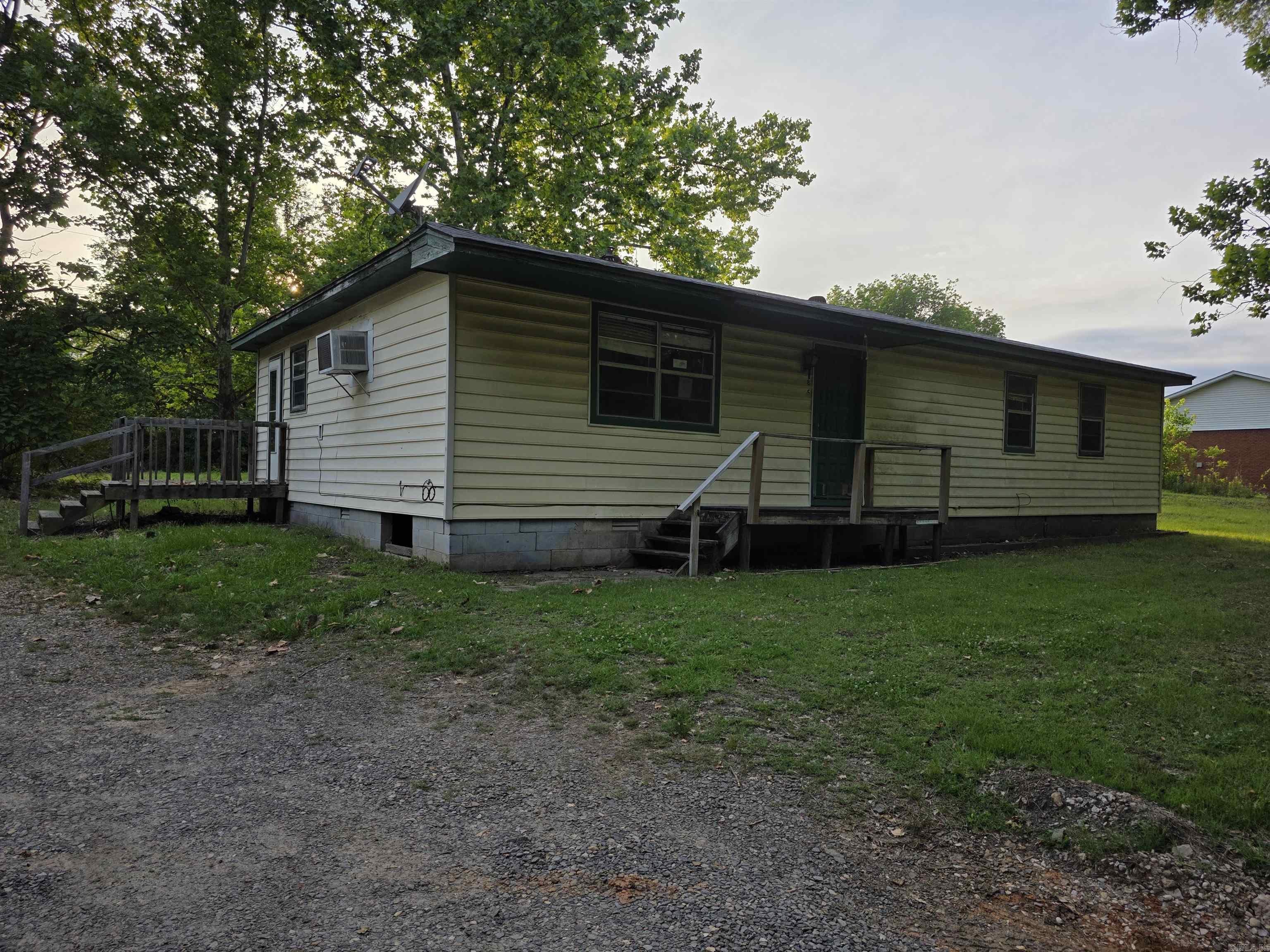 Country living near the Arkansas River. I-40 and US-64 are minutes from the house. 3 bedroom, 1.5 bath home sits on 1 acre with an outbuilding in the backyard. The utility room has a closet, houses the water heater, washer dryer, and has room for freezer, etc. Kitchen/dining combo offers space to meal prep and discuss the days events. The address is Morrilton, and the home is in the Oppelo area.