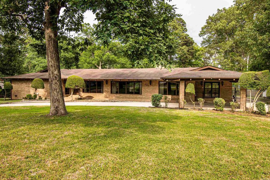This stately residence, boasting a generous 406 square feet, was the first home ever built on the prestigious Timberlane Drive, offering a blend of classic charm and modern convenience. A grand circle driveway welcomes you, featuring a carport at the front for convenient parking. Additionally, an oversized carport at the back provides ample space for extra vehicles. Come embrace the spaciousness of this remarkable property! Key Features: -Built in 1966 -5 bedrooms -6 bathrooms -1.25 acre lot size