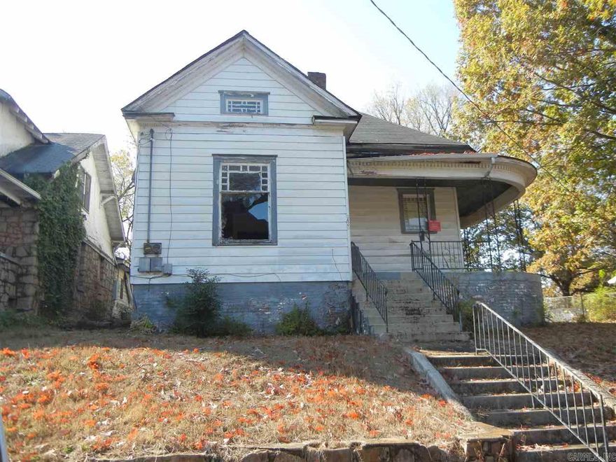 A city notice is posted on the property to protect public because of required repairs. This is a duplex that can be rebuilt! All offers must be presented with Buyer's acknowledgement that Seller has members who are AR Real Estate Brokers.  No mineral, gas, or oil rights are to be conveyed. Conveyance of the property shall be made to buyer by Special Warranty Deed. No offers accepted without earnest money!! Title insurance and survey are at buyer's expense. Property sold “As Is”, No disclosure available.