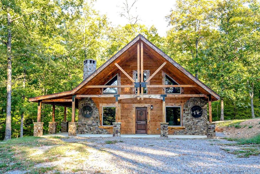 Situated in the heart of the Ouachita National Forest, this brand-new, expertly crafted, 1.5 story log sided CUSTOM cabin is brimming with rustic charm! The interior boasts attractive tongue & groove blue ponderosa pine and intricate cedar woodworking throughout. Expansive windows flood the space with natural light and the kitchen includes a unique cedar live edge island, knotty alder cabinets, Whirlpool appliances, butcher block countertops, with pantry. The exterior offers a 700 sq ft. covered porch and wired for a future hot tub! Step outside and you are greeted with breathtaking panoramic mountain views. Hunters take notice as the bordering national forest is known for an abundance of diverse wildlife such as whitetail deer, wild turkey, black bears, and other small game. With easy access to ATV trails systems, hiking trails, and numerous waterways, this is an outdoor enthusiast's dream property! Features include a shared stocked pond, and a 30x30 additional building that could be used as a workshop or cabin. This property sits within a 38 acre private gated community and is surrounded by five additional log homes, just outside of beautiful Shady, AR.